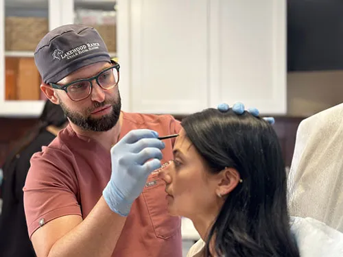 Dr. Lyman determines where to place Botox on a patient