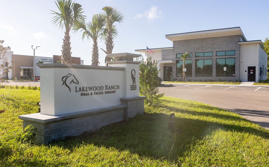 Lakewood Ranch Oral & Facial Surgery exterior sign with modern office building and palm trees