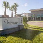 Lakewood Ranch Oral & Facial Surgery exterior sign with modern office building and palm trees